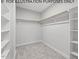 Large walk-in closet with shelving and hanging rods at 210 Lilliput Ln, Wake Forest, NC 27587