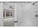 Modern bathroom with a large walk-in shower, tile surround, and updated fixtures at 210 Lilliput Ln, Wake Forest, NC 27587