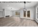 Spacious great room featuring fireplace and access to screened porch at 210 Lilliput Ln, Wake Forest, NC 27587