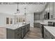 Modern kitchen with gray cabinets and large island at 210 Lilliput Ln, Wake Forest, NC 27587