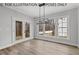 Bright breakfast nook with access to screened porch and wooded views at 210 Lilliput Ln, Wake Forest, NC 27587