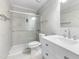 Bathroom with a walk-in shower, white vanity, and tiled walls at 1308 S State St # C, Raleigh, NC 27610