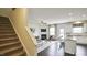 View of staircase and open living area with fireplace and hardwood floors at 401 Shorthorn Dr, Wake Forest, NC 27587