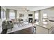 Open concept kitchen and living room with island, fireplace, and hardwood floors at 401 Shorthorn Dr, Wake Forest, NC 27587