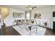 Bright and airy living room features hardwood floors and a comfortable seating area at 401 Shorthorn Dr, Wake Forest, NC 27587
