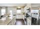 Modern kitchen features stainless steel appliances and granite countertops at 401 Shorthorn Dr, Wake Forest, NC 27587