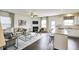 Open concept kitchen and living room with island, fireplace, and hardwood floors at 401 Shorthorn Dr, Wake Forest, NC 27587