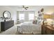 Large main bedroom with ceiling fan, ample natural light, and wall decor at 401 Shorthorn Dr, Wake Forest, NC 27587