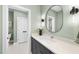 Spa-like bathroom with a walk-in shower and modern vanity at 7644 Falls Creek Ln, Raleigh, NC 27614