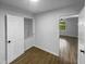 Bedroom with wood-look floors and access to closet at 825 Chalmers St, Durham, NC 27707
