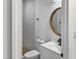 Modern bathroom with white vanity, a large mirror, and a walk-in shower at 825 Chalmers St, Durham, NC 27707