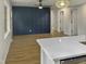 Bright dining room features hardwood floors and a statement wall at 825 Chalmers St, Durham, NC 27707