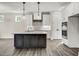 Modern kitchen with a large island and stainless steel appliances at 112 Lambert Ln, Fuquay Varina, NC 27526