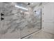 Large walk-in shower with marble tile and frameless glass enclosure at 112 Lambert Ln, Fuquay Varina, NC 27526