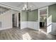 Open dining room with view into the kitchen and hardwood floors at 112 Lambert Ln, Fuquay Varina, NC 27526