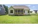 House exterior showcasing the backyard and screened porch at 112 Lambert Ln, Fuquay Varina, NC 27526