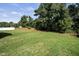 Spacious backyard with grassy lawn and mature trees at 112 Lambert Ln, Fuquay Varina, NC 27526