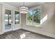 Bright breakfast nook with hardwood floors and view of backyard at 112 Lambert Ln, Fuquay Varina, NC 27526