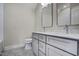 Modern bathroom with double vanity, tile floor, and a tub at 112 Lambert Ln, Fuquay Varina, NC 27526