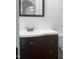 Bathroom with dark vanity and a white sink at 1611 Carriage Dr, Franklinton, NC 27525