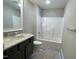 Bathroom with tub and granite vanity at 120 Old Garden Ln, Youngsville, NC 27596