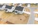 Aerial view of the back of a house with a small covered porch and sodded yard at 535 Husketh Rd, Youngsville, NC 27596