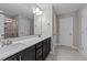 Modern bathroom featuring double vanity and dark wood cabinets at 535 Husketh Rd, Youngsville, NC 27596