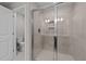 Walk-in shower with frameless glass door and tiled walls at 535 Husketh Rd, Youngsville, NC 27596