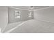 Spacious bedroom with plush carpet and large windows at 535 Husketh Rd, Youngsville, NC 27596