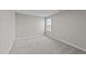 Empty bedroom with carpet and single window at 535 Husketh Rd, Youngsville, NC 27596