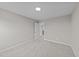 Empty bedroom with neutral gray carpet and open doorway at 535 Husketh Rd, Youngsville, NC 27596