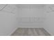 Spacious, empty walk-in closet with wire shelving at 535 Husketh Rd, Youngsville, NC 27596