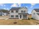 Two-story home with gray siding, stone accents, and a covered front porch at 535 Husketh Rd, Youngsville, NC 27596