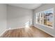 Home office or den with wood-style flooring and a large window at 535 Husketh Rd, Youngsville, NC 27596