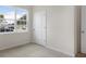 Well-lit bedroom featuring a window and neutral wall colors at 7638 Michelle Rd, Rocky Mount, NC 27803