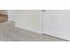 Carpeted hallway with neutral walls and doors at 7638 Michelle Rd, Rocky Mount, NC 27803