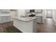 Kitchen island with granite countertop and stainless steel appliances at 7638 Michelle Rd, Rocky Mount, NC 27803