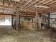 Open interior barn with wooden beams, offering plenty of storage at 3721 Brightwood Ln, Durham, NC 27703