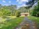 Brick ranch house nestled on a spacious lot with a long driveway at 3721 Brightwood Ln, Durham, NC 27703