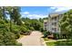 Apartment building with parking and wooded area at 1234 Kelton Cottage Way, Morrisville, NC 27560