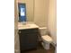 Modern bathroom with gray vanity and white toilet at 115 Ironwood Blvd # 51, Youngsville, NC 27596