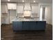 Modern kitchen with large island and white cabinets at 115 Ironwood Blvd # 51, Youngsville, NC 27596