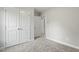 Bright bedroom with double door closet and neutral colored carpet at 95 Cresent Dr, Princeton, NC 27569