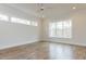 Spacious bedroom with hardwood floors and large windows at 1690 Terry Rd, Durham, NC 27712