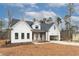 Modern farmhouse exterior with white siding and dark accents at 1690 Terry Rd, Durham, NC 27712