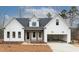 Modern farmhouse exterior with white siding and dark accents at 1690 Terry Rd, Durham, NC 27712