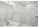 Bathroom with marble shower and modern vanity at 4711 Cypress Tree Ln, Raleigh, NC 27612
