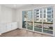 Bright living room with sliding doors to balcony at 4711 Cypress Tree Ln, Raleigh, NC 27612