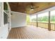 Spacious wooden deck with ceiling fan and outdoor lighting at 242 Lakestone Estates, Pittsboro, NC 27312