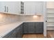 Modern kitchen features white and gray cabinets and quartz countertops at 242 Lakestone Estates, Pittsboro, NC 27312